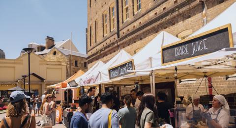 Crowds enjoying a visit to The Rocks Friday Foodie Market along Playfair Street, The Rocks